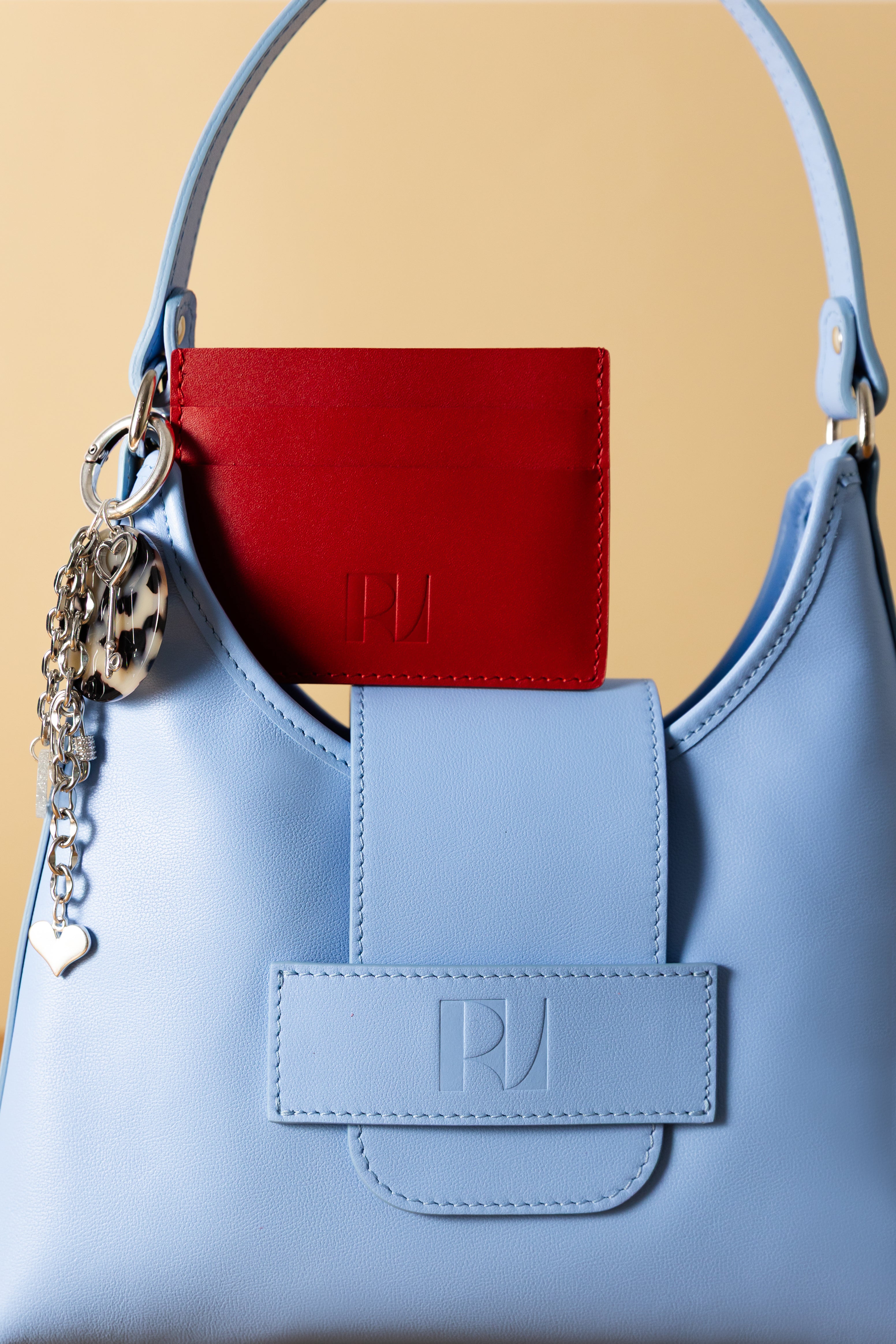 porte cartes Pitchoun rouge sur le sac fada taille S bleu clair